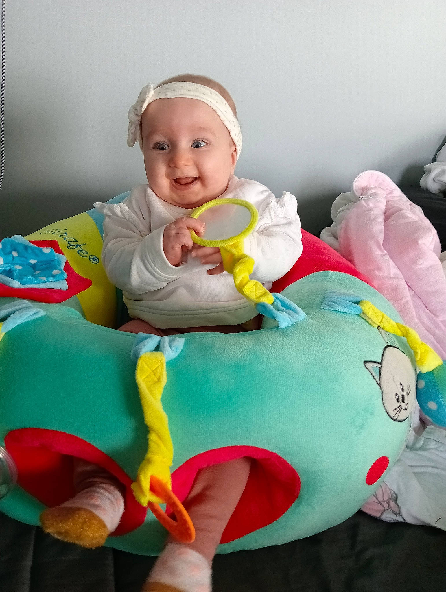 Maddie participe au concours pour gagner de l'argent avec cette photo : baby, baby_playing_with_toys, baby_products, baby_safety, baby_toddler_clothing, baby_toys, child, comfort, fun, happy, joy, linens, person, pink, product, room, sitting, sleeve, smile, stuffed_toy