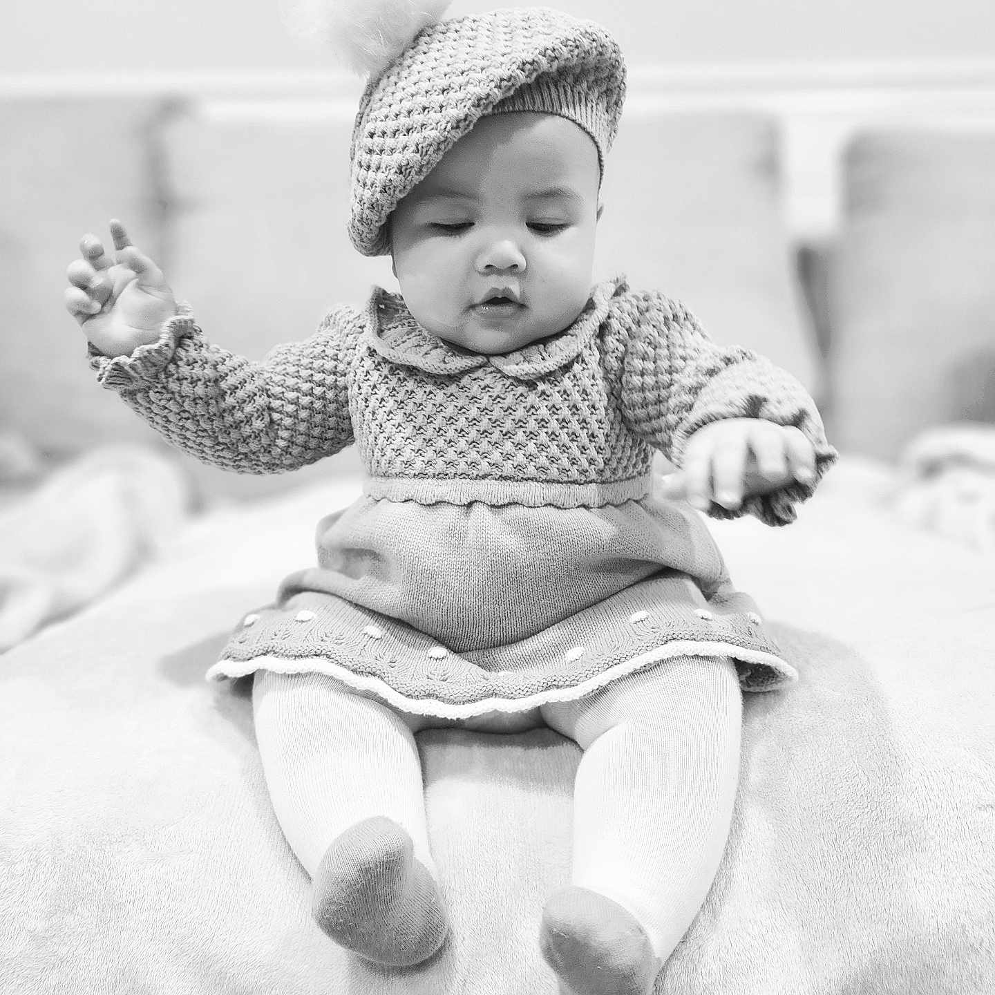 Addison is registered to the contest to win money with this photo: baby, bed, bodypart, bonnet, cap, clothing, face, finger, furniture, hand, happy, hat, head, hood, newborn, person, photography, portrait, sitting, smile