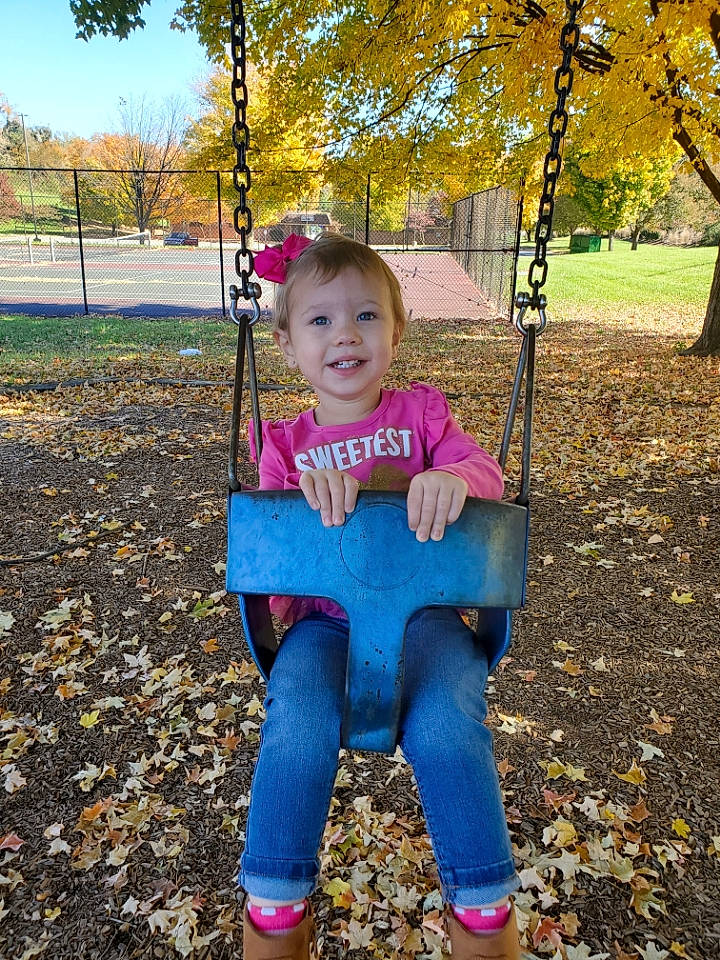Kimberly joined the competition — help win amazing prizes! baby_toddler_clothing, child, fun, grass, happy, human_settlement, joy, leaf, leisure, orange, people_in_nature, person, plant, playground, public_space, recreation, sky, smile, swing, toddler