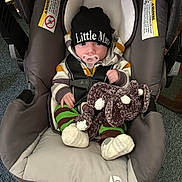 Liam joined the competition — help win amazing prizes! baby, car_seat, pacifier, plush_toy, elephant_toy, hat, beanie, striped_clothing, hoodie, infant, child, indoor, carpet, seat_belt, cute, cozy, soft_toy, child_in_seat, sitting, young_child
