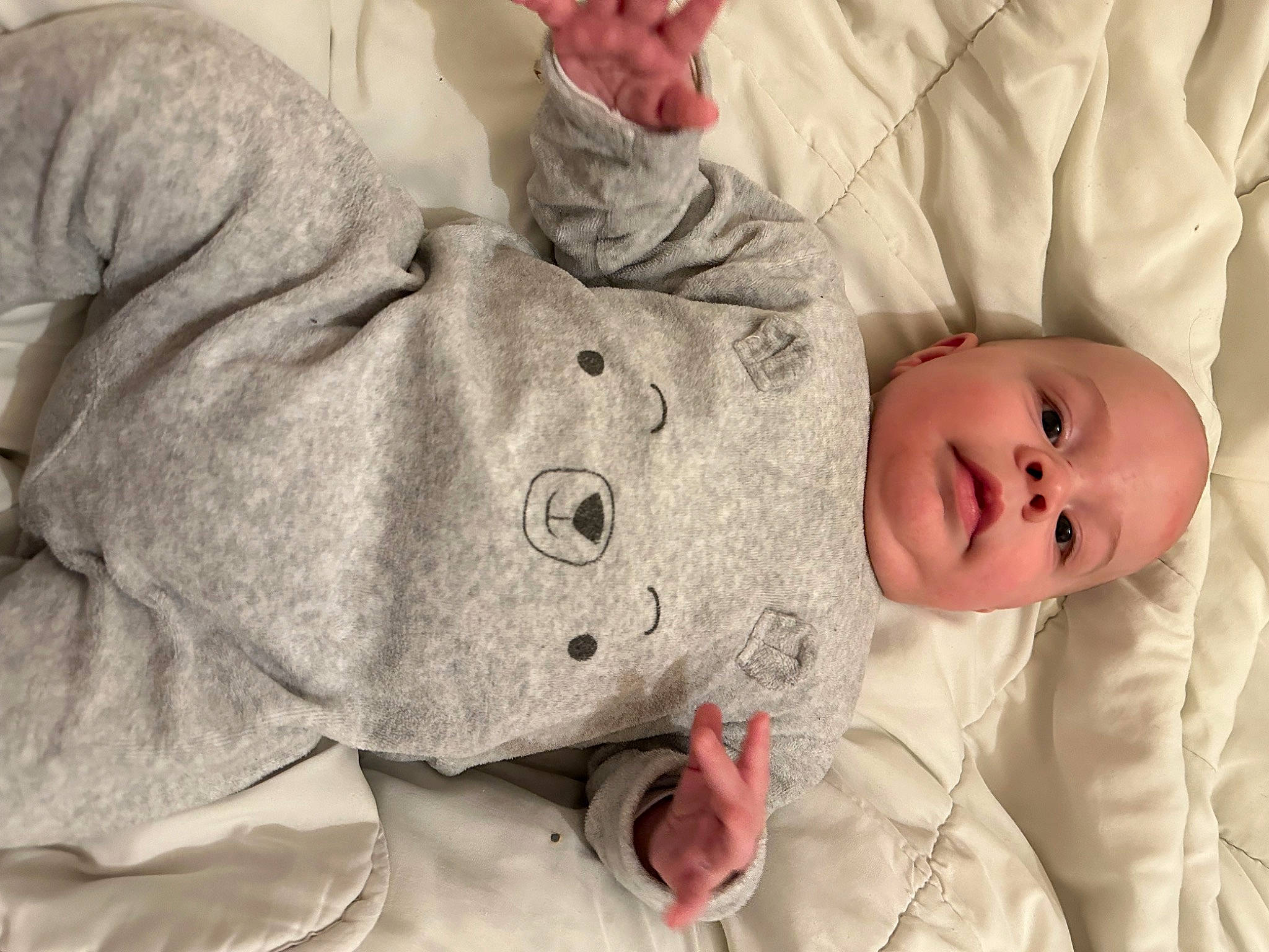 Hayden participe au concours pour gagner de l'argent avec cette photo : baby, baby_sleeping, baby_toddler_clothing, cheek, child, comfort, finger, fur, gesture, hand, human_body, lip, mammal, mouth, nose, person, skin, sleeve, thumb, toddler