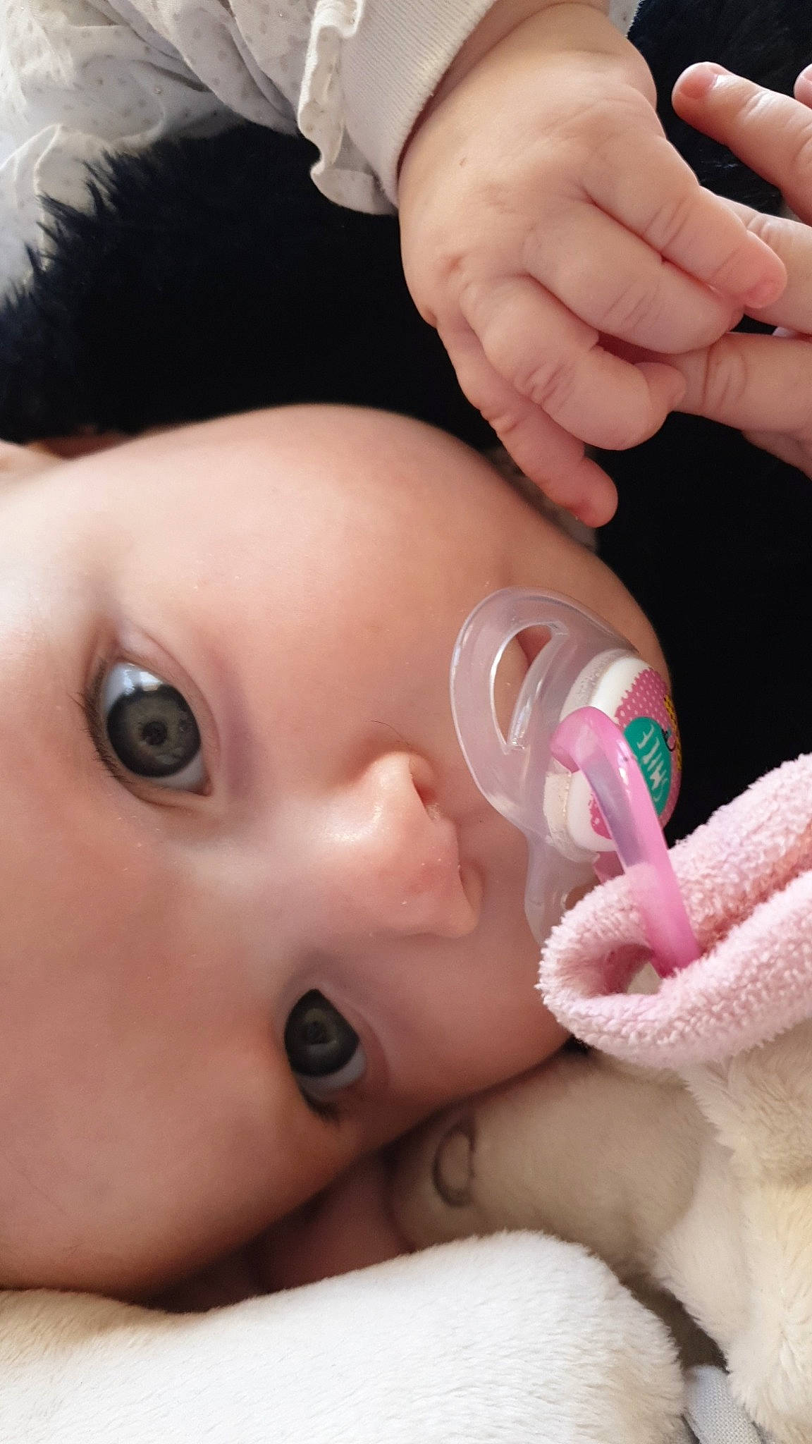 Cathy participe au concours pour gagner de l'argent avec cette photo : baby, baby_products, baby_sleeping, baby_toddler_clothing, beauty, cheek, child, eyebrow, eyelash, finger, gesture, headwear, iris, lip, nail, organ, person, photography, product, skin