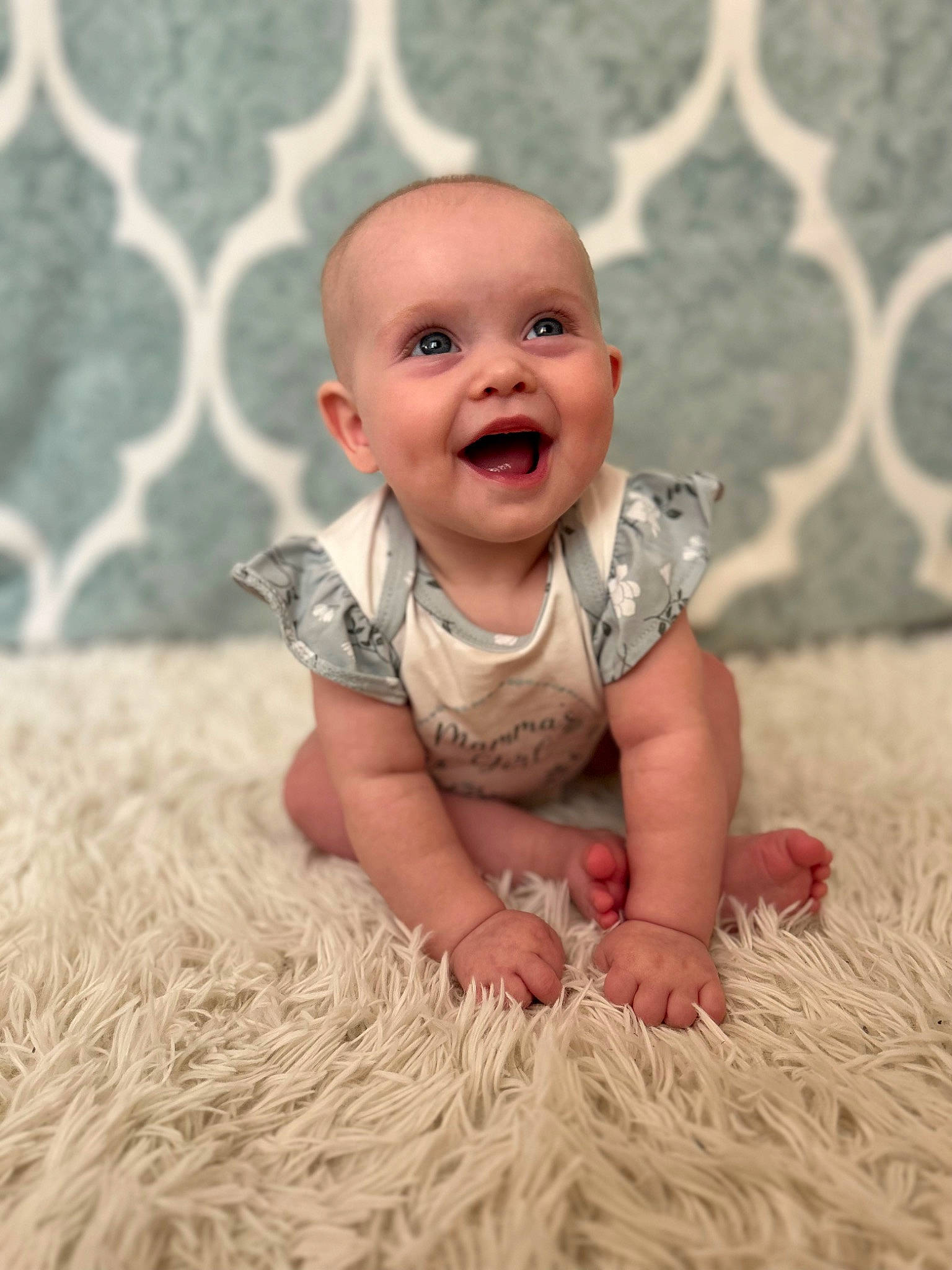 Mabel is registered to the contest to win money with this photo: baby, baby_toddler_clothing, cheek, child, eye, face, flash_photography, flooring, grass, happy, head, human_body, nose, people_in_nature, person, plant, skin, sleeve, smile, toddler