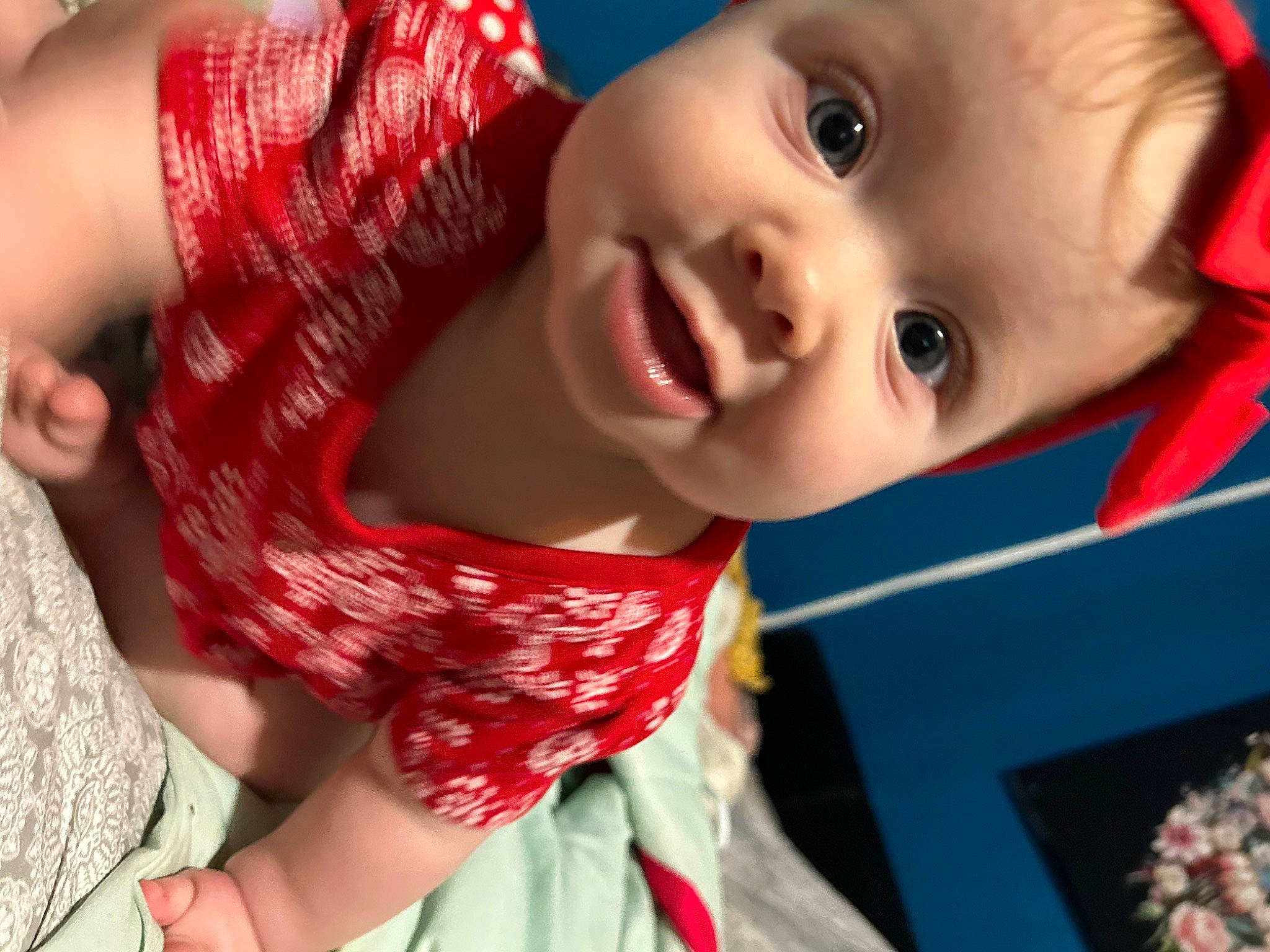 Aria is registered to the contest to win money with this photo: baby, baby_toddler_clothing, cheek, child, elbow, eye, eyebrow, eyelash, facial_expression, fun, happy, iris, lip, mouth, nose, person, plaid, red, skin, smile