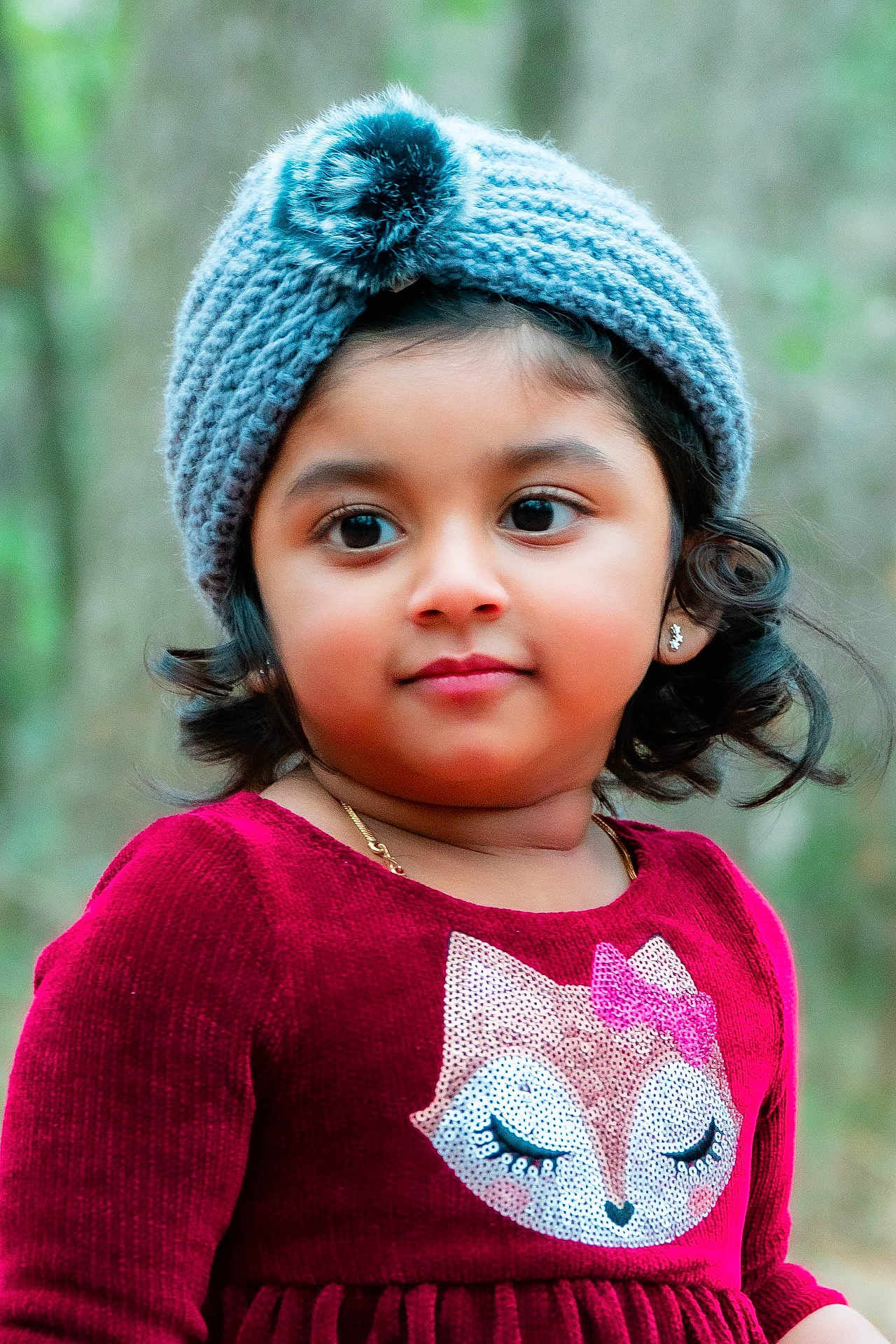 Taniyah joined the competition — help win amazing prizes! child, girl, portrait, hat, knitted_hat, pom_pom, red_dress, sequins, fox_design, outdoor, forest, curly_hair, earrings, necklace, cute, smiling, young_child, fall, warm_clothing, fashion