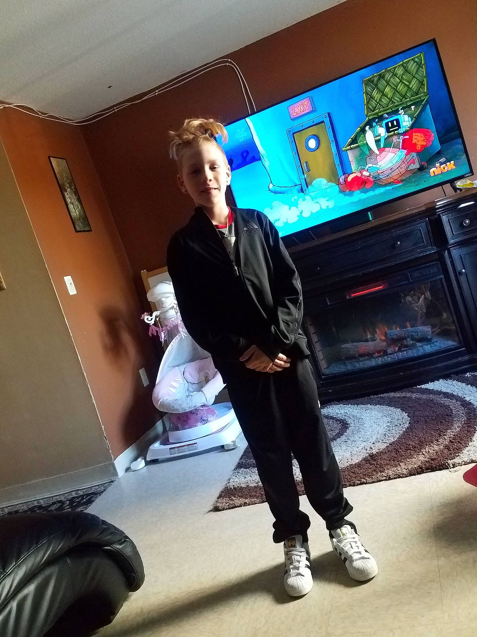 Charlie is registered to the contest to win money with this photo: fashion, footwear, jacket, jeans, leggings, person, room, shoe, standing, trousers