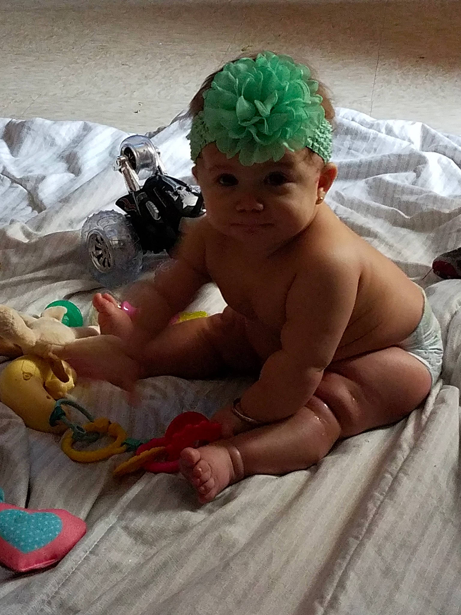 Lucianna is registered to the contest to win money with this photo: baby, child, headgear, muscle, person, sitting