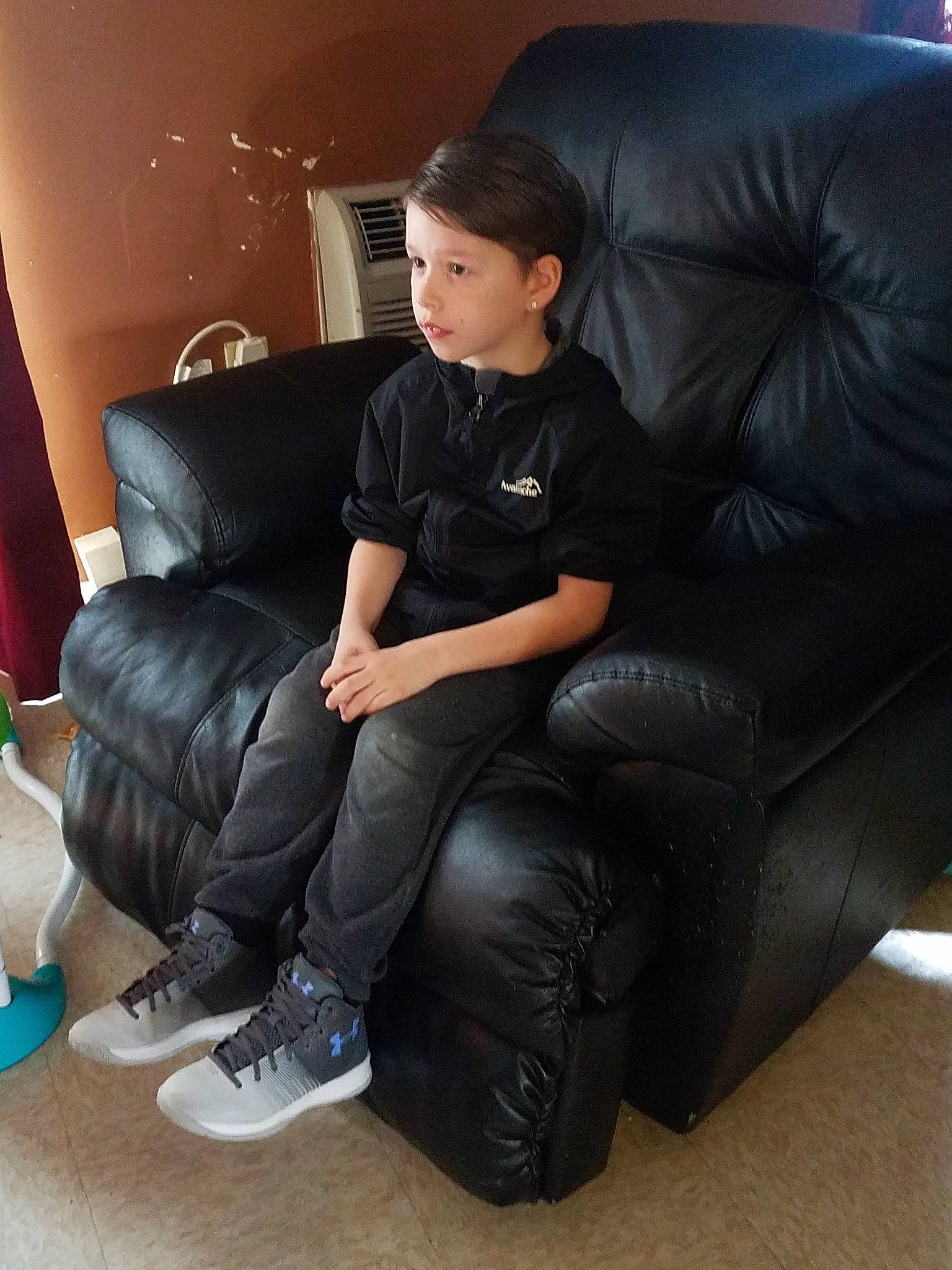 Joey joined the competition — help win amazing prizes! black_hair, chair, comfort, couch, finger, footwear, furniture, lap, leather, leg, person, recliner, shoe, sitting, thigh