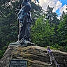 Freckles is registered to the contest to win money with this photo: adventure, animal, cat, clouds, curious, daylight, exploration, forest, greenery, harness, leash, nature, outdoor, pet, rock, sculpture, sky, statue, trees, wildlife