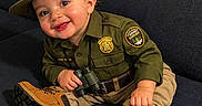 Jan Lucas joined the competition — help win amazing prizes! baby, badge, binoculars, boots, child, costume, couch, cute, green_shirt, happy, hat, indoors, park_ranger, person, portrait, sitting, smiling, toddler, uniform, young_child