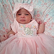 Ja'Mazia is registered to the contest to win money with this photo: baby, infant, pink_dress, headband, bow, blanket, floral_pattern, cute, portrait, child, newborn, soft_fabric, indoors, person, young_child, lying_down, fashion, apparel, tulle_skirt, adorable