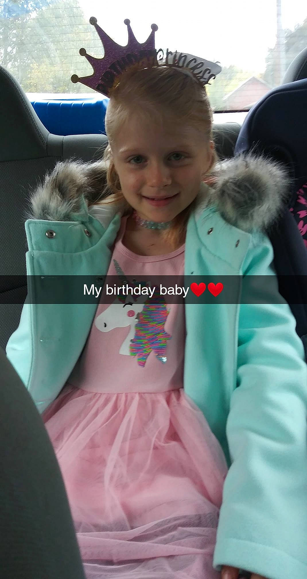 Trinity is registered to the contest to win money with this photo: blond, child, event, face, fawn, finger, hair, hairstyle, happy, iris, joy, mammal, necklace, person, pink, skin, sleeve, smile, snapshot, t_shirt