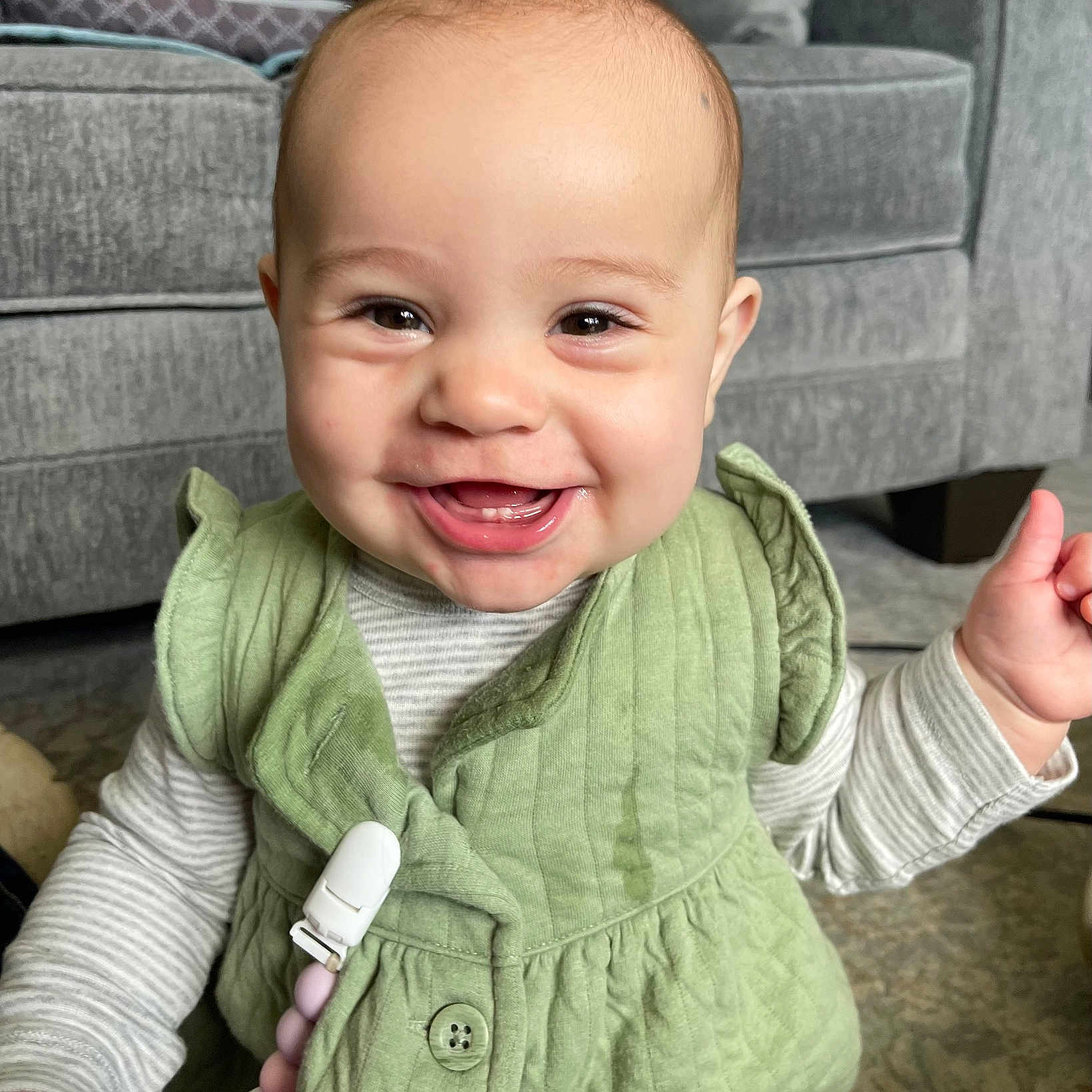 Savannah joined the competition — help win amazing prizes! baby, babylaughing, bodypart, clothing, coat, couch, face, finger, furniture, hand, happy, head, jacket, knitwear, laughing, person, photography, portrait, smile, sweater