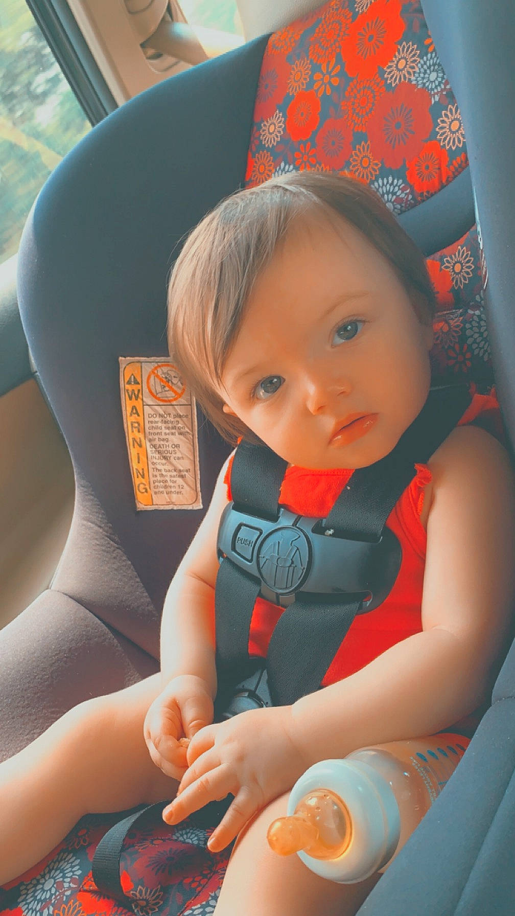 Ember is registered to the contest to win money with this photo: auto_part, baby, baby_carriage, baby_in_car_seat, beauty, cap, car_seat, child, comfort, finger, fun, human, human_body, mouth, orange, person, product, skin, steering_wheel, toddler