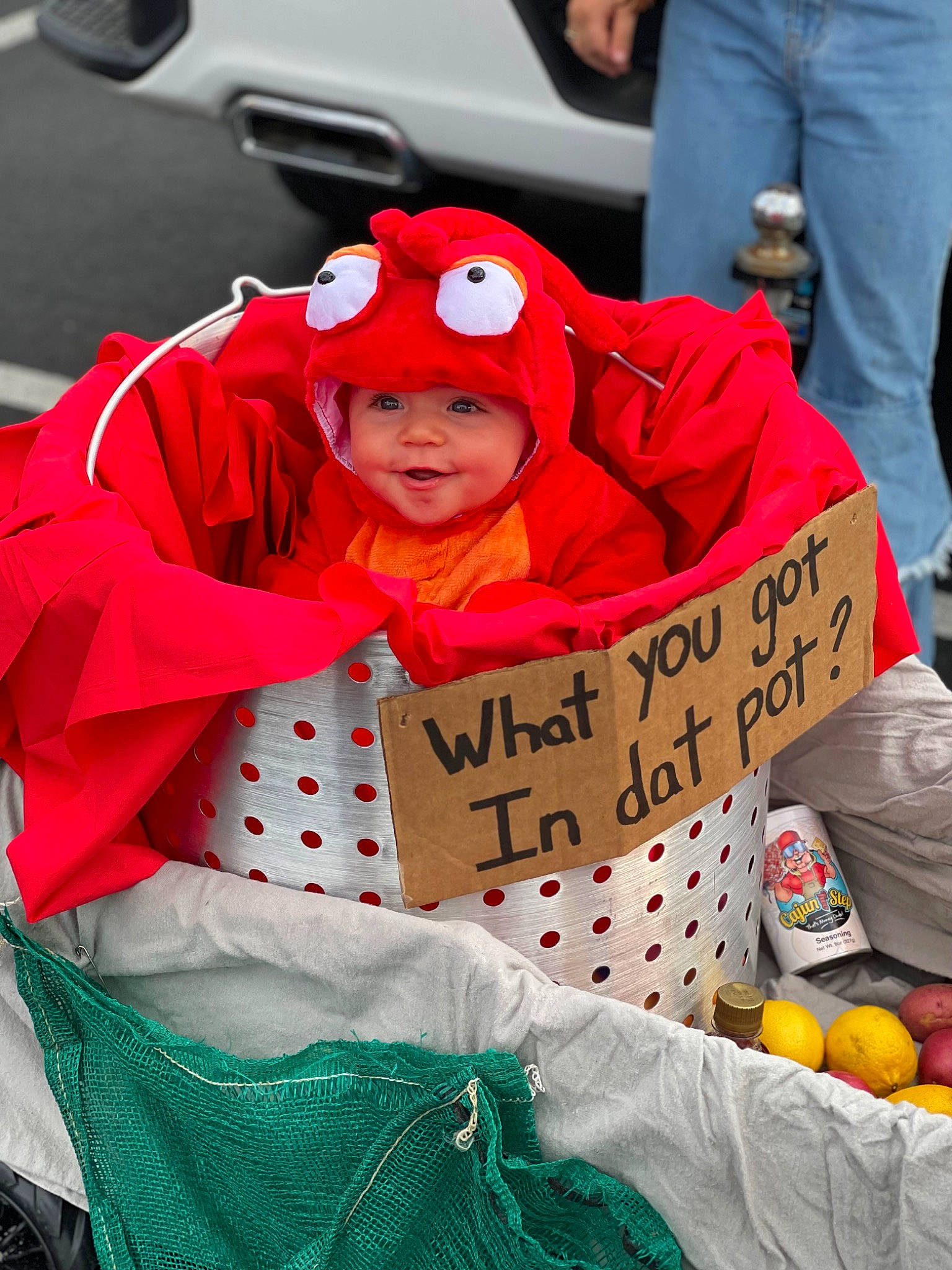 Creed is registered to the contest to win money with this photo: baby, carmine, child, event, fun, green, happy, headwear, holiday, jacket, local_food, natural_foods, people, person, personal_protective_equipment, public_event, recreation, red, sitting, toddler