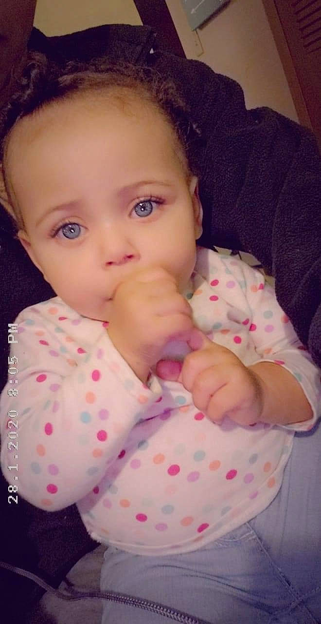 Jane is registered to the contest to win money with this photo: baby, beauty, brown_hair, cheek, child, chin, eye, eyebrow, face, finger, forehead, head, iris, lip, mouth, nose, pattern, person, pink, skin