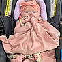 baby, blanket, car_seat, child, clothing, comfort, cute, expression, face, feet, hands, headband, holding, indoor, infant, person, pink, portrait, seat, soft