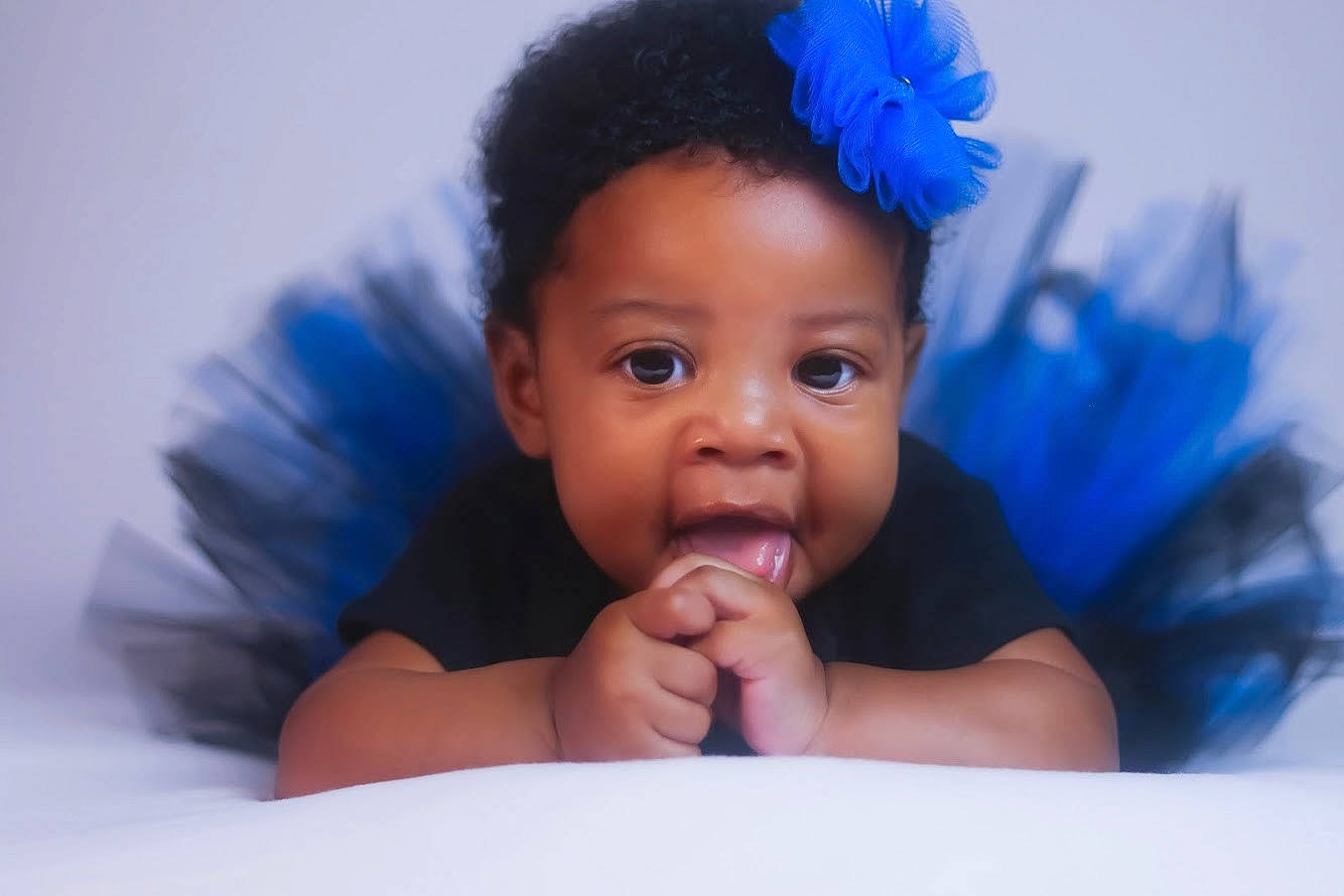 Carolina joined the competition — help win amazing prizes! baby, black_hair, blue, cheek, child, close_up, eye, face, fun, hair_accessory, head, headgear, iris, lip, mouth, nose, person, photography, skin, smile