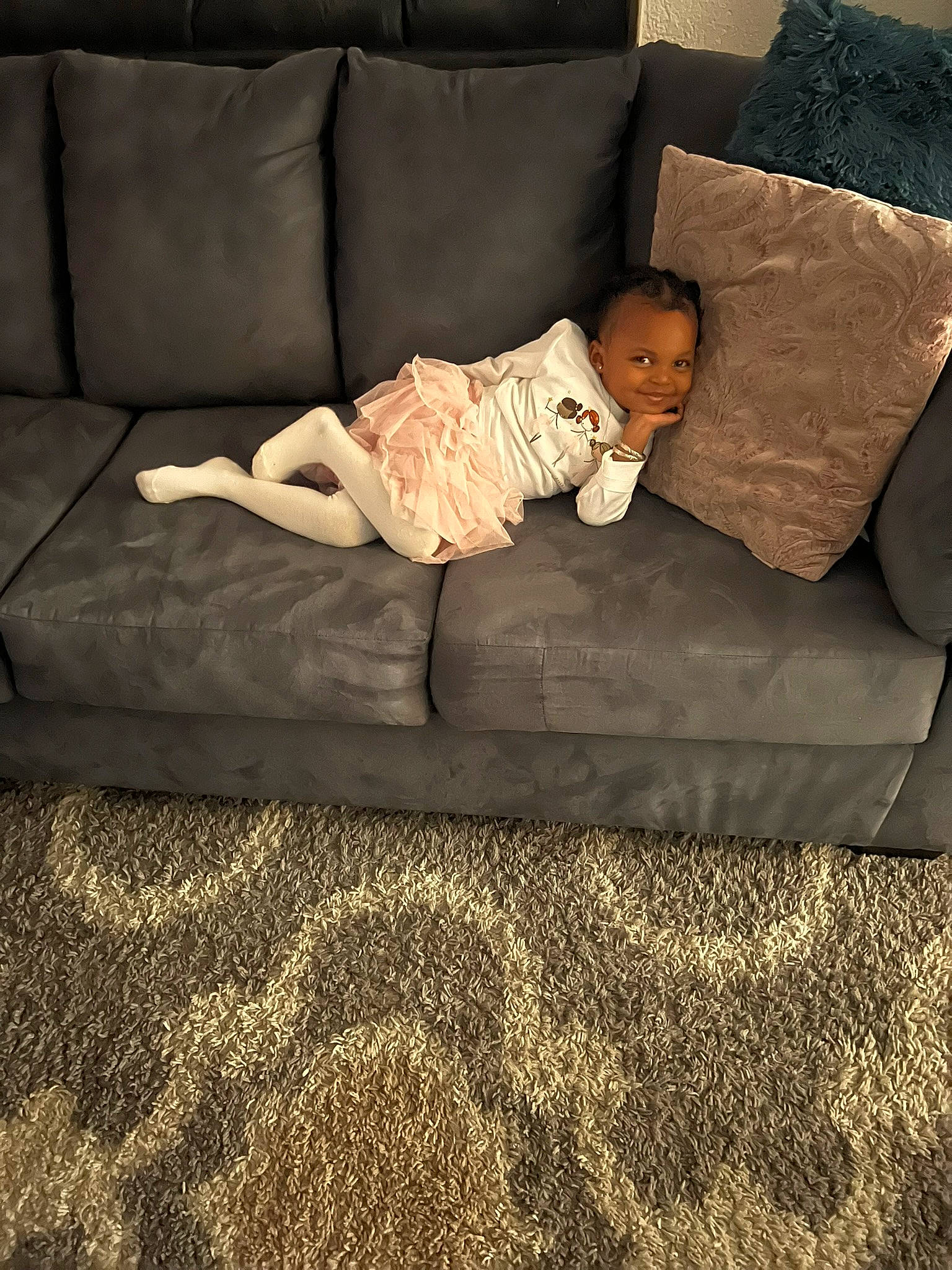 Malaya is registered to the contest to win money with this photo: bedding, bedroom, carpet, comfort, couch, floor, flooring, furniture, hardwood, joy, linens, living_room, person, rectangle, room, sitting, sofa_bed, studio_couch, throw_pillow, tints_and_shades