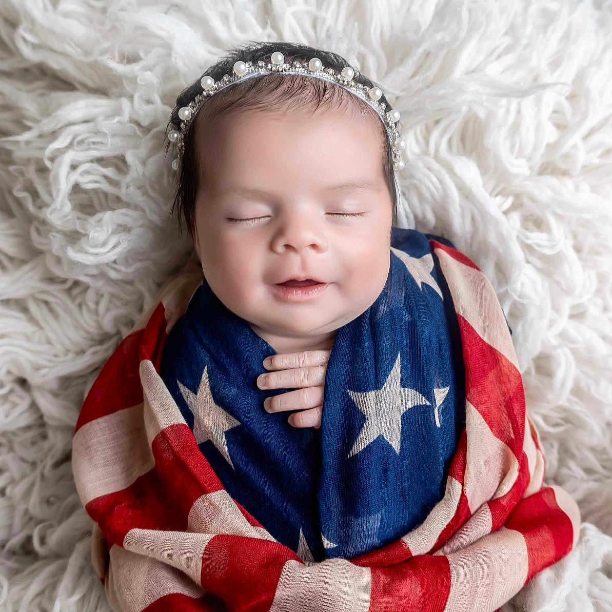 Bella is registered to the contest to win money with this photo: baby, blanket, clothing, face, head, newborn, people, person, photography, portrait, scarf, sleeping