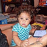 Arion joined the competition — help win amazing prizes! arm, blanket, blue_shirt, books, bookshelf, child, curly_hair, fan, furniture, hand, indoor, living_room, milk_mustache, person, phone, poster, skin, tattoo, toddler, toy