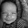 Zoriya is registered to the contest to win money with this photo: adorable, baby, black_and_white, blanket, child, close_up, collar, cozy, eyes, face, fleece, hair, happy, indoor, infant, lying_down, photography, portrait, smiling, striped_clothing