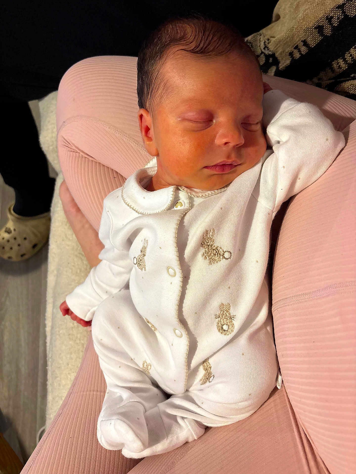 Jude joined the competition — help win amazing prizes! baby, newborn, sleeping, onesie, pink_cushion, embroidery, indoor, cozy, child, person, soft_texture, hand, footed_pajamas, peaceful, cute, infant, relaxed, portrait, sleep, rest