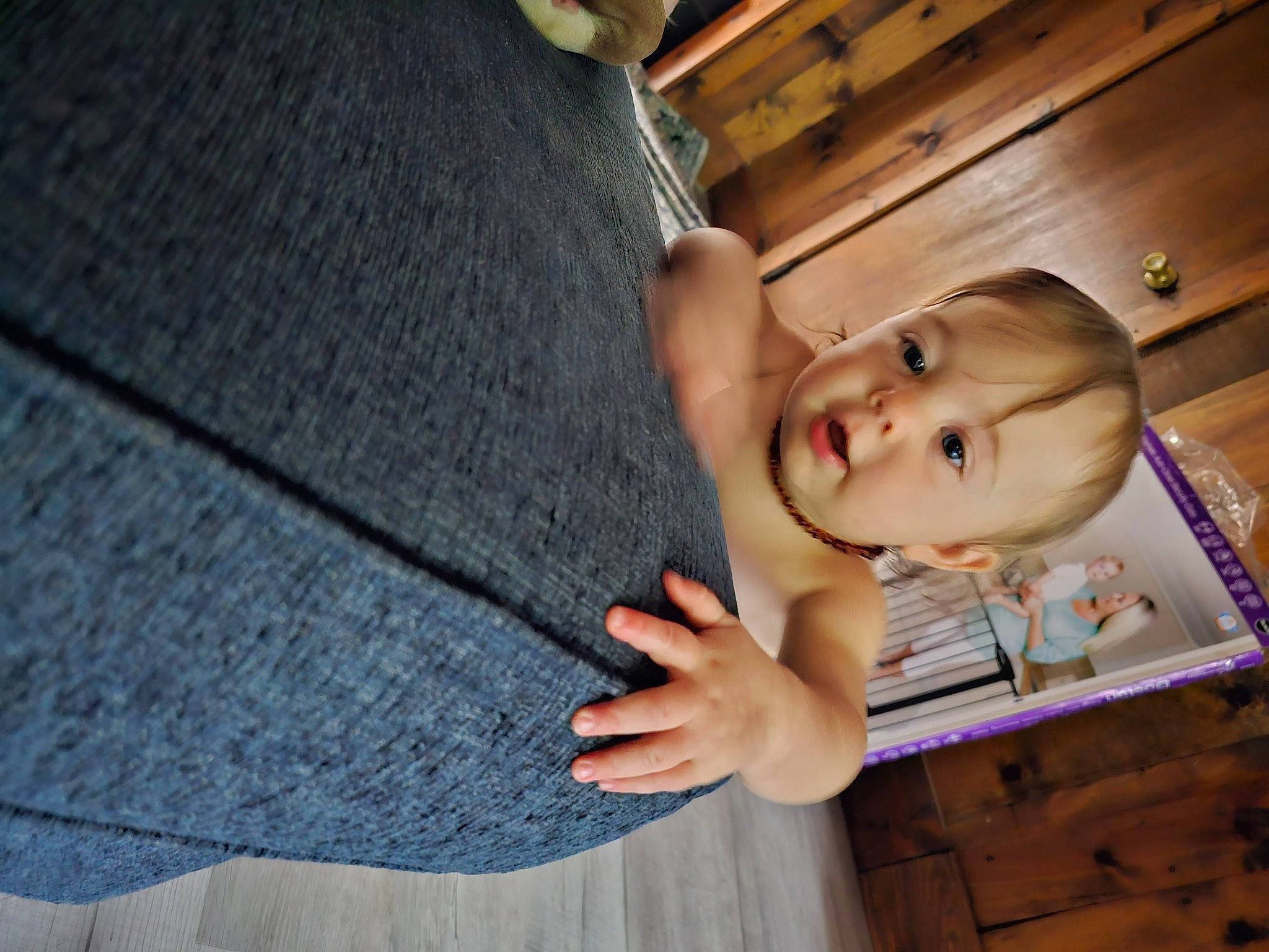 Izabella is registered to the contest to win money with this photo: baby, baby_toddler_clothing, blazer, blurred, button, child, comfort, denim, eye, flooring, formal_wear, happy, hardwood, pattern, person, room, sitting, sleeve, toddler, tree