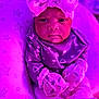 baby, infant, headband, bow, mittens, pillow, stars, purple_light, cozy, clothing, cute, portrait, indoors, soft_texture, young_child, sitting, expression, face, person, blanket