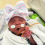 newborn, baby, hospital, medical_tape, feeding_tube, blanket, hat, striped_hat, swaddled, sleeping, infant, patient, healthcare, hand, cute, child, person, portrait, indoors, closeup