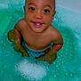 baby, bath_bubbles, bath_time, bathtub, child, cute, foam, happy, indoors, infant, kid, looking_up, person, playful, sitting, skin, smiling, water, wet_skin, young_child