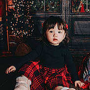 Zephanie joined the competition — help win amazing prizes! baby, bodypart, clothing, dress, face, finger, footwear, hand, happy, hardwood, head, pants, person, photography, portrait, shoe, sitting, smile, tartan, wood