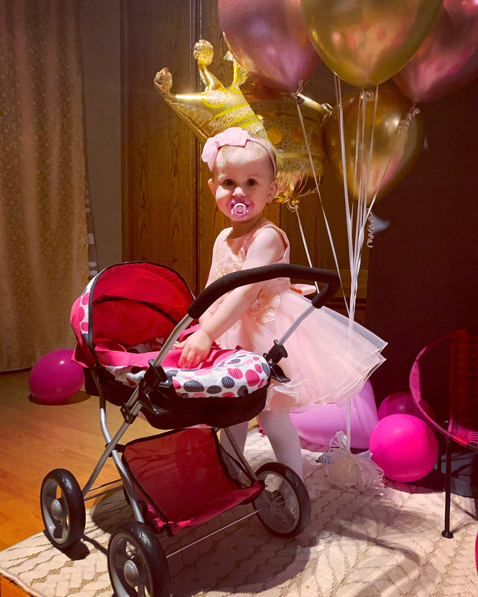 Milana participe au concours pour gagner de l'argent avec cette photo : baby, baby_carriage, baby_products, balloon, child, curtain, event, fun, happy, light, magenta, party_supply, person, photograph, pink, purple, snapshot, tire, toddler, wheel