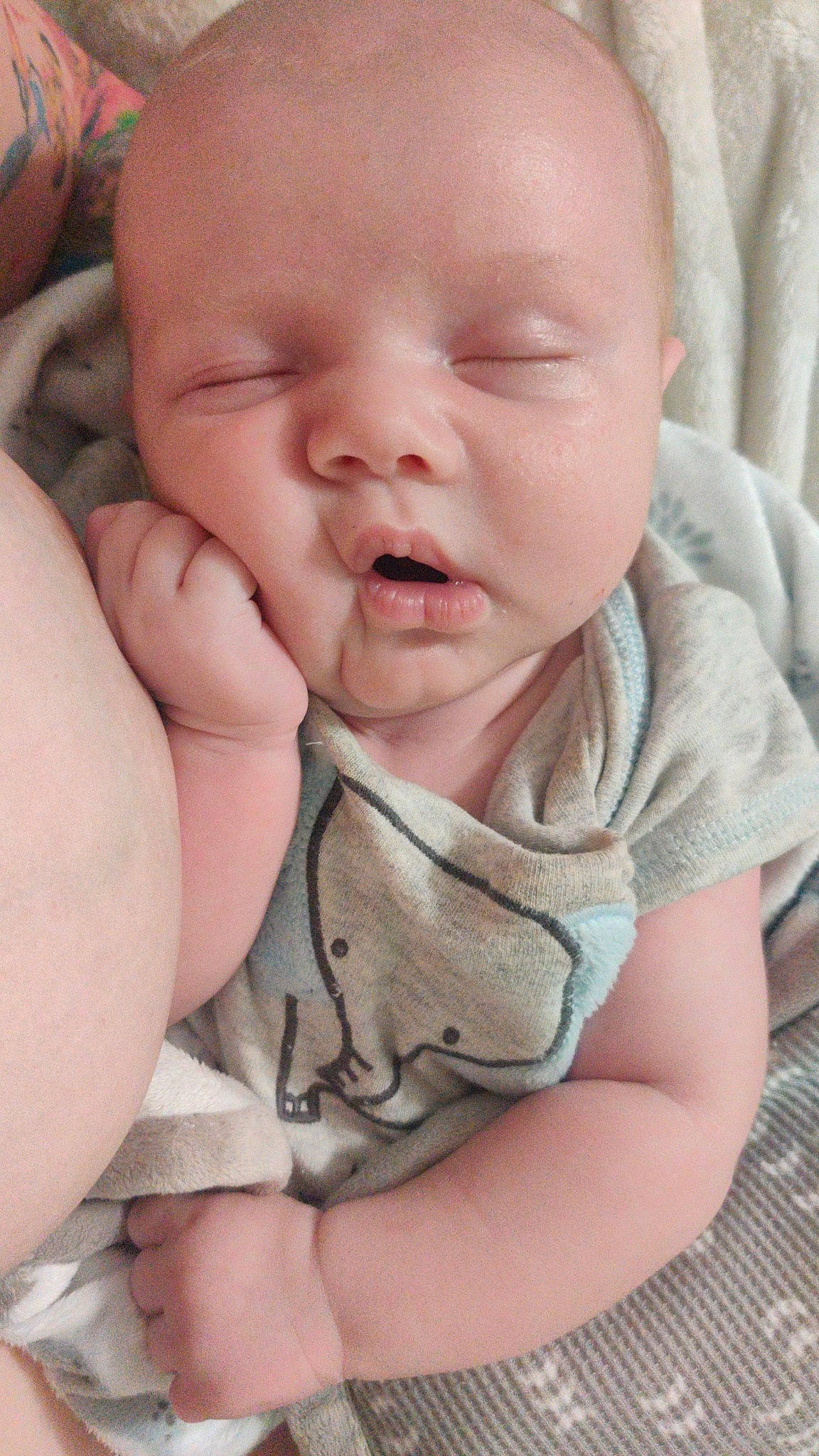 Jaxon is registered to the contest to win money with this photo: baby, baby_products, baby_toddler_clothing, cheek, child, chin, comfort, finger, gesture, grass, happy, iris, linens, mouth, nose, person, sitting, skin, sleeve, thumb