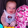 Ellie is registered to the contest to win money with this photo: baby, blue_eyes, child, clothing, crocheted, cute, face, hand, happy, infant, minnie_mouse, octopus, pink, plush_toy, sitting, smiling, soft, stroller, toy, white