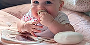 Ellie is registered to the contest to win money with this photo: baby, infant, pacifier, blue_eyes, chubby_cheeks, soft_toys, blanket, pillow, cute, smiling, closeup, indoors, child, adorable, playtime, soft_lighting, portrait, happy, person, cozy