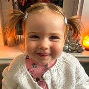 Ellie joined the competition — help win amazing prizes! child, toddler, girl, smiling, portrait, face, pigtails, hair_clips, cardigan, sweater, pink_shirt, clothing, indoors, home, autumn, decorations, flowers, warm_lighting, close_up, happy