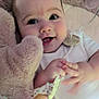 baby, smiling, face, toy, teddy_bear, hand, blanket, infant, cute, child, white_clothing, pacifier_clip, soft_texture, lying_down, happy, closeup, indoors, comfort, playful, young