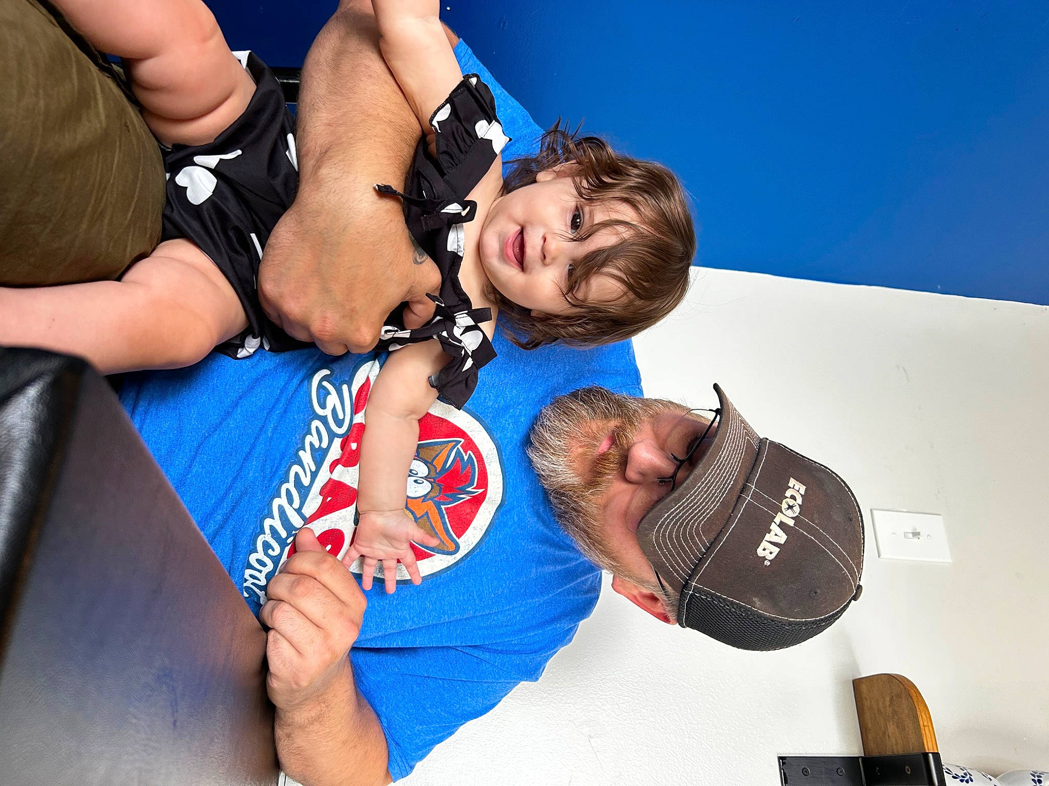 Elsie is registered to the contest to win money with this photo: baseball_cap, chest, contact_sport, elbow, electric_blue, event, eyewear, fashion_accessory, fun, gesture, happy, hat, headwear, leisure, muscle, person, recreation, striking_combat_sports, t_shirt, thigh