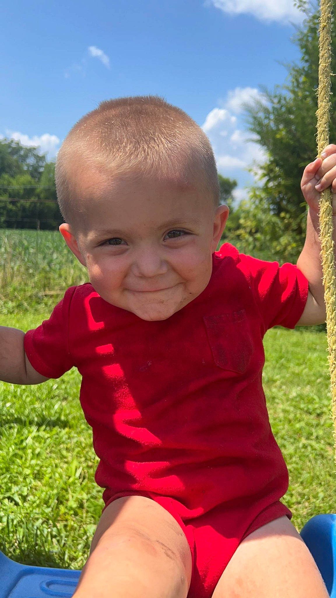 Steven is registered to the contest to win money with this photo: baby, baby_toddler_clothing, child, cloud, facial_expression, finger, fun, grass, green, happy, joy, leisure, people_in_nature, person, plant, skin, sky, smile, standing, summer