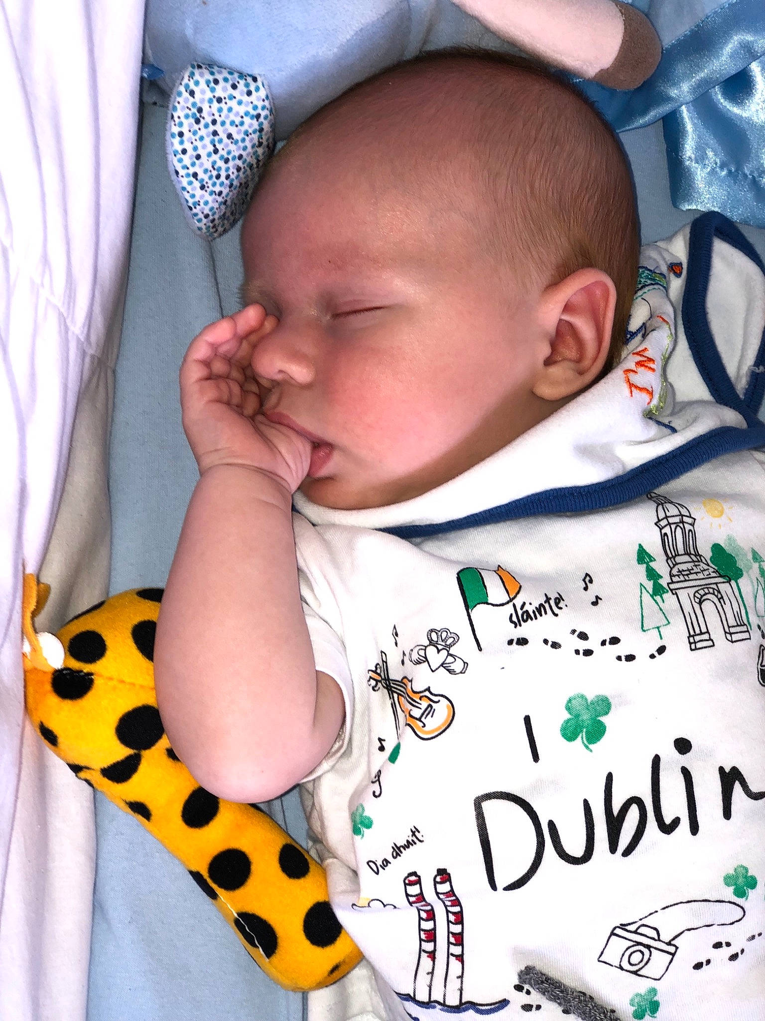 Theo is registered to the contest to win money with this photo: baby, baby_products, baby_sleeping, baby_toddler_clothing, cheek, child, ear, hair_accessory, head, pattern, person, product, sleep, toddler