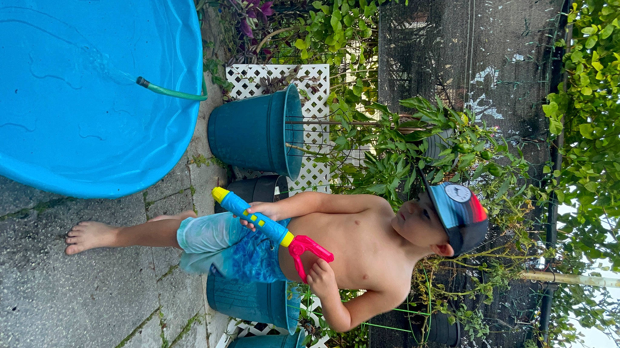 Quinton joined the competition — help win amazing prizes! barechested, blue, electric_blue, flip_flops, foot, fun, grass, hat, headwear, human_leg, joint, knee, leisure, person, plant, recreation, shorts, summer, swimwear, thigh