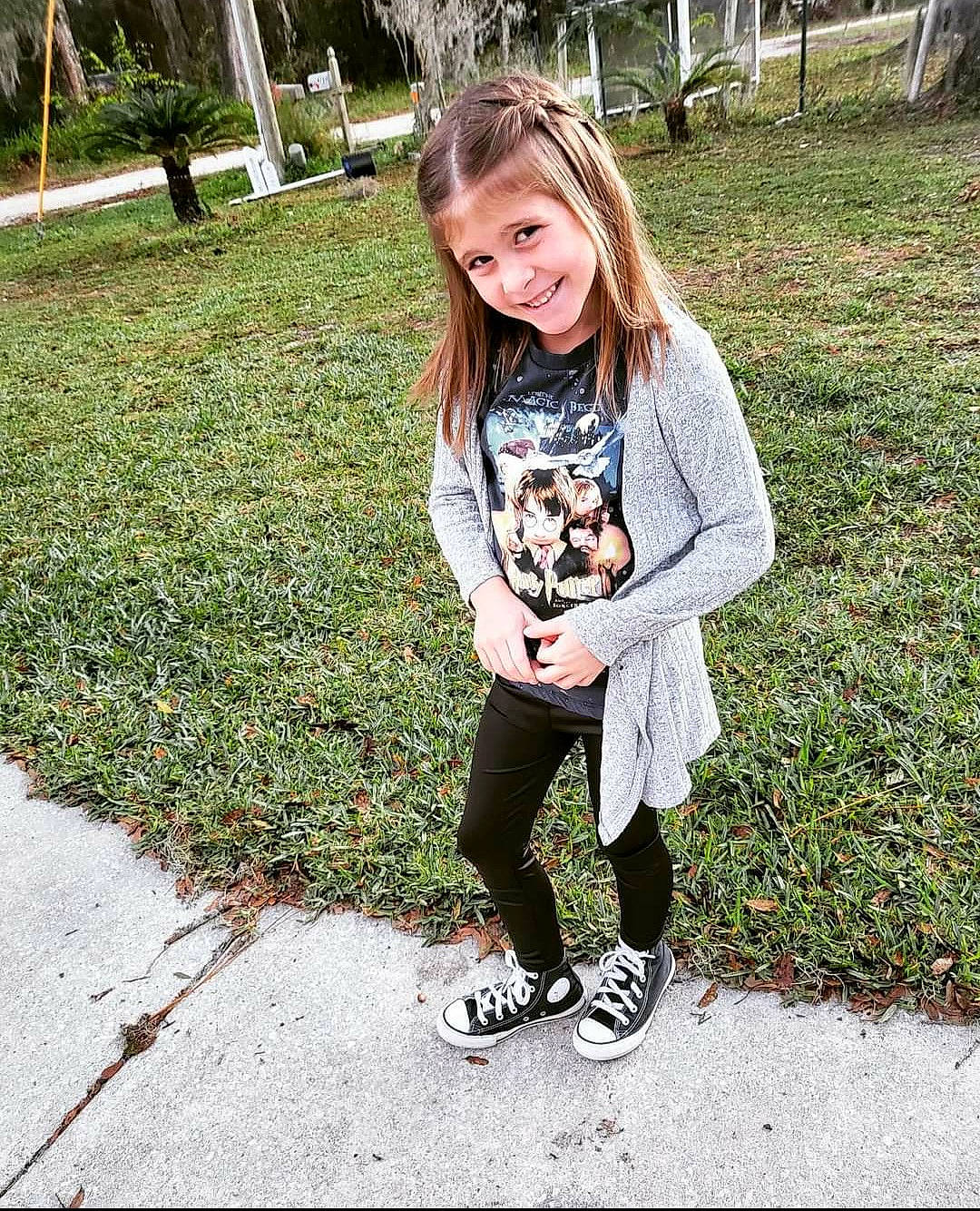 Ella joined the competition — help win amazing prizes! bangs, brown_hair, denim, eyewear, grass, hair, happy, jewellery, joy, knee, long_hair, pattern, people_in_nature, person, plant, recreation, shoe, sleeve, smile, t_shirt