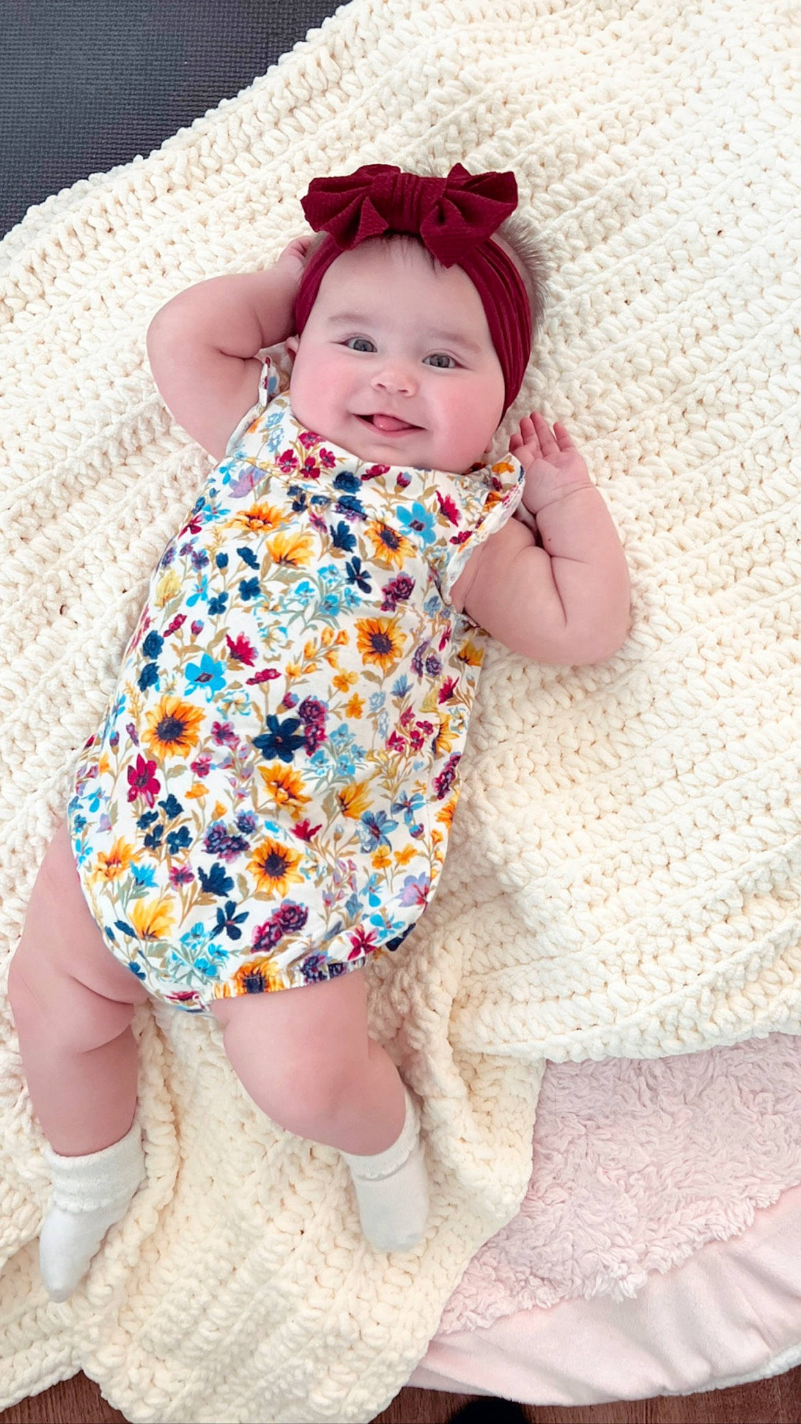 Kora is registered to the contest to win money with this photo: baby, baby_toddler_clothing, collar, dress, face, finger, happy, head, headwear, joy, leg, pattern, person, pink, product, purple, skin, sleeve, smile, standing
