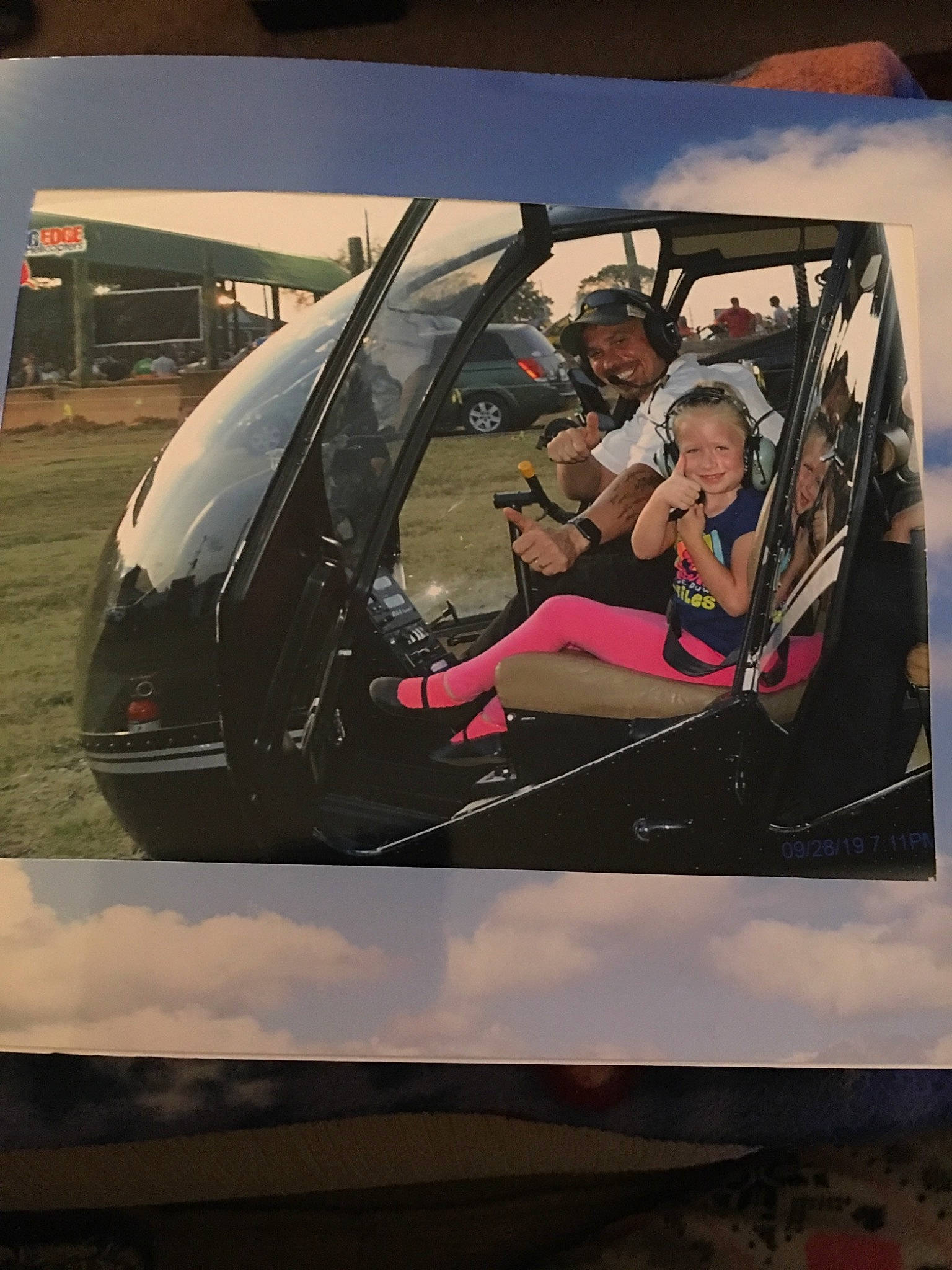 Taelynn is registered to the contest to win money with this photo: art, auto_part, automotive_design, automotive_exterior, automotive_window_part, car, city_car, glass, joy, mode_of_transport, motor_vehicle, person, transport, vehicle, vehicle_door, windshield