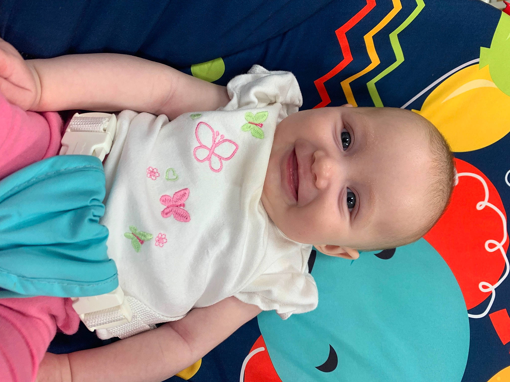 Kyra is registered to the contest to win money with this photo: baby, baby_products, baby_toddler_clothing, cheek, child, eye, face, finger, happy, head, iris, joy, mouth, nose, person, pink, product, skin, sleeve, smile