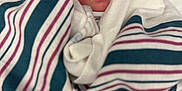 Kamilah is registered to the contest to win money with this photo: architecture, baby, bed, blanket, building, clothing, face, furniture, glove, hat, head, hospital, newborn, person, photography, portrait, quilt, sleeping, towel