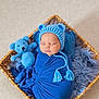 Shaun participe au concours pour gagner de l'argent avec cette photo : baby, basket, blanket, blue, child, cozy, crocheted_toy, cute, headwear, indoor, infant, knitted_hat, newborn, nursery, portrait, resting, sleeping, soft_texture, teddy_bear, wrapped