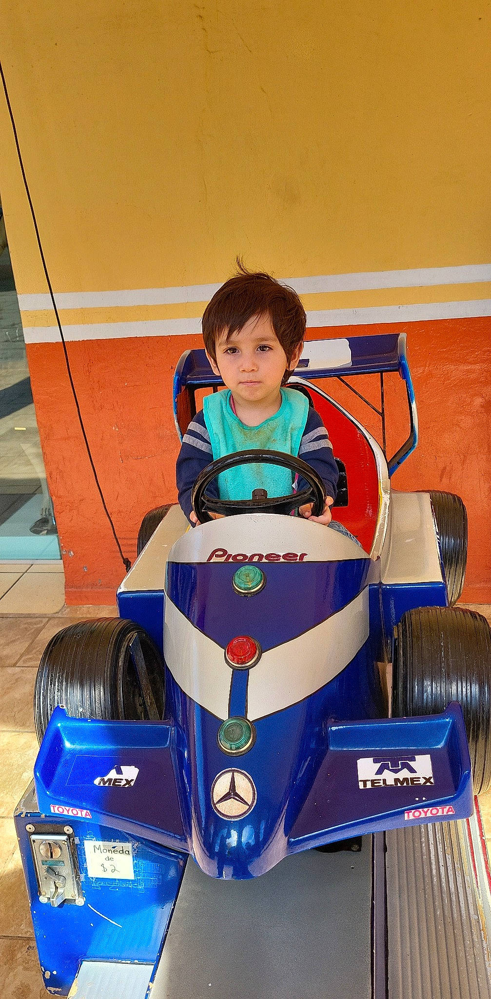 Xander is registered to the contest to win money with this photo: auto_part, automotive_design, automotive_exterior, automotive_tire, automotive_wheel_system, car, electric_blue, formula_one_tyres, fun, motor_vehicle, motorsport, open_wheel_car, person, race_car, racing, riding_toy, sports, tire, toddler, vehicle