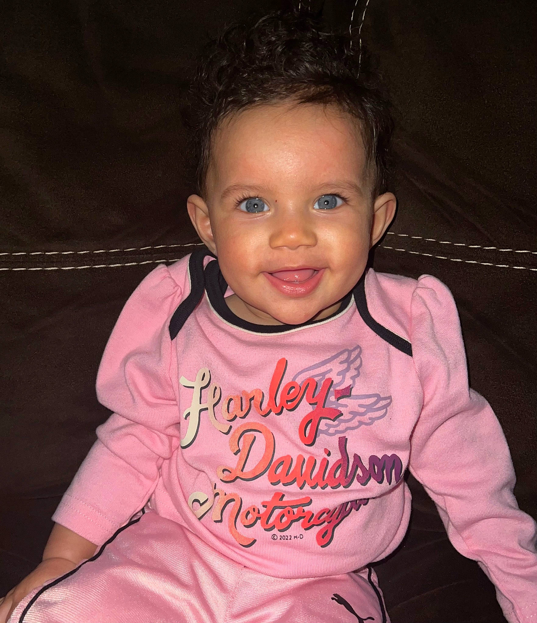 Ivy is registered to the contest to win money with this photo: baby_toddler_clothing, cheek, chin, eye, eyebrow, face, flash_photography, forehead, gesture, hair, happy, head, human_body, joy, lip, neck, outerwear, person, pink, skin